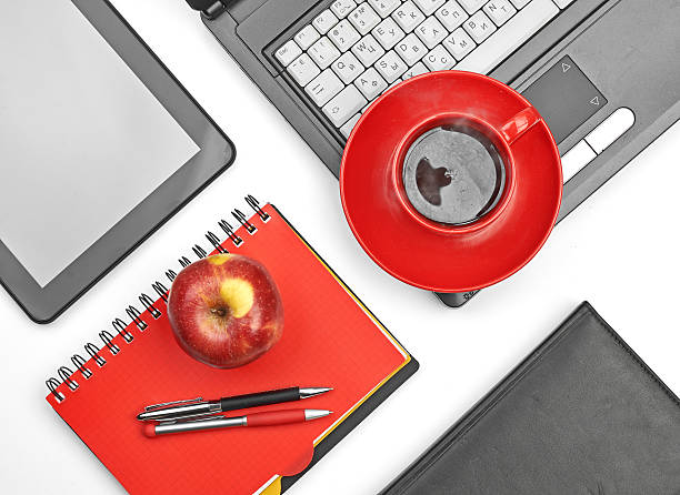 istock Laptop and office supplies on white 184679221