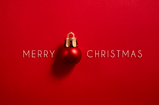 Christmas ornament with Merry Christmas message on red background