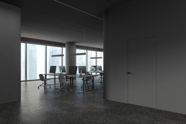 istock Grey coworking interior with desk and chairs in row, pc monitors and window 1846795839