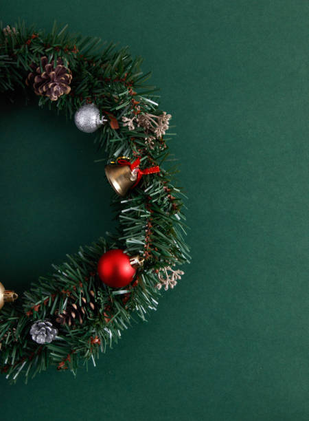 istock Christmas flowers and decorations on an isolated green background 1846823679