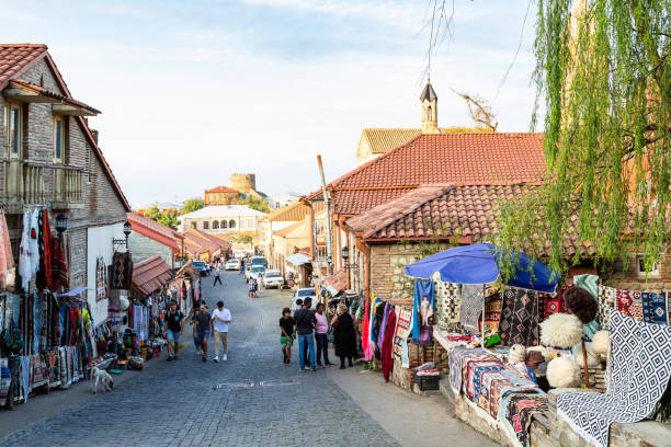 street in old Sighnaghi town in Kakheti region Signagi, Georgia - September 24, 2023: street with local gifts in old Sighnaghi town in Kakheti region in Georgia in autumn evening kakheti georgia stock pictures, royalty-free photos & images