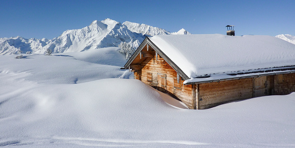 Panorama of ski chalets in the snowy alps of the Zillertal in Tirol Austria