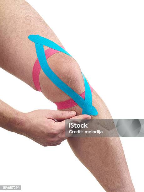 Therapeutic Treatment Of Knee With Kinesio Tex Tape Stock Photo - Download Image Now
