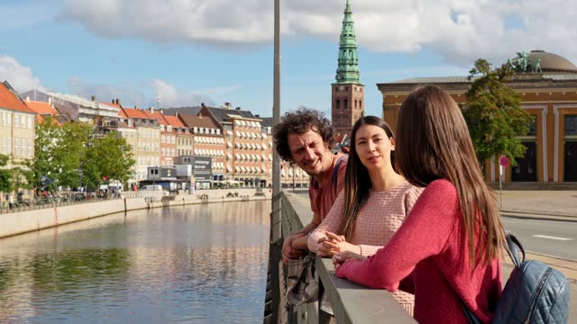 Three Young Friends On The Bridge In Copenhagen In Denmark