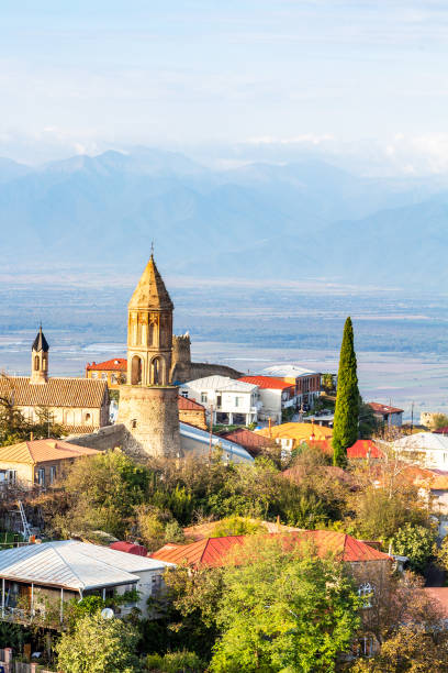cathedral in Signagi town over Alazan valley travel to Georgia - cathedral in Signagi town over Alazan valley in Kakheti region in Georgia on sunny autumn evening kakheti georgia stock pictures, royalty-free photos & images
