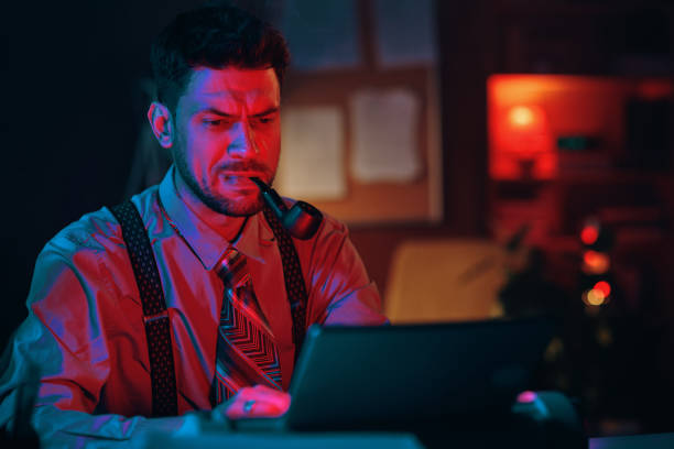 istock Young serious businessman sitting by workplace in front of typewriter 1846885402