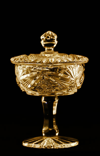 Antique bright crystal holder with lid Antique bright crystal holder with lid isolated on black background crystal chalice stock pictures, royalty-free photos & images