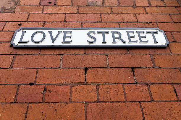 Love Street Sign on a red brick wall
