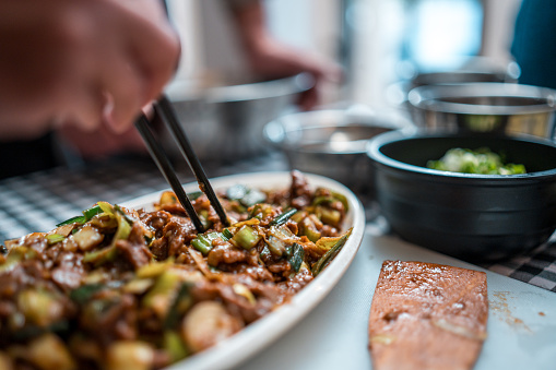 Close-up of a plate of delicious Chinese stir-fry Wok-tossed beef with colorful vegetables and aromatic spices on a cooking class.