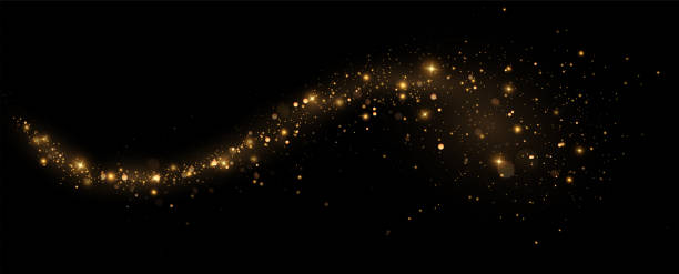 istock christmas light effect, sparkling magic dust particles.a trail of golden particles. A trail of stardust. Space sparkling. 1846907590