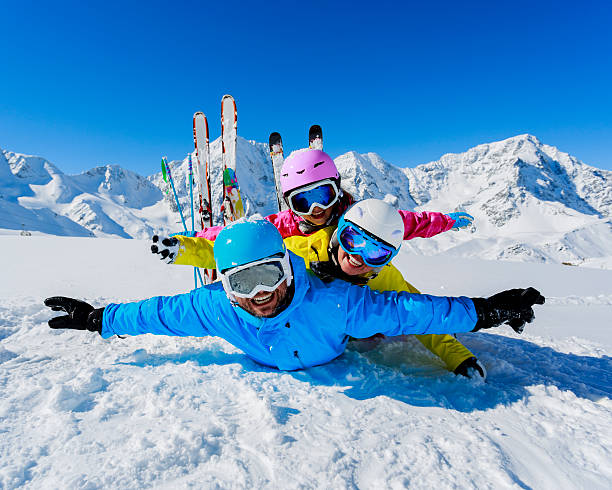 Skiing, winter, snow,  skiers, sun and fun stock photo