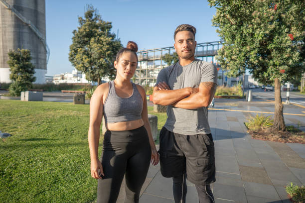 Portrait photo of a male and female pacific islanders in exercise clothing