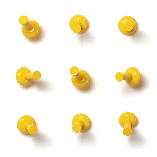 Set of yellow push pins with different angles isolated