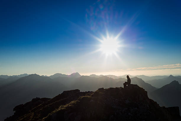 istock thinking girl on mountain peak 184694833