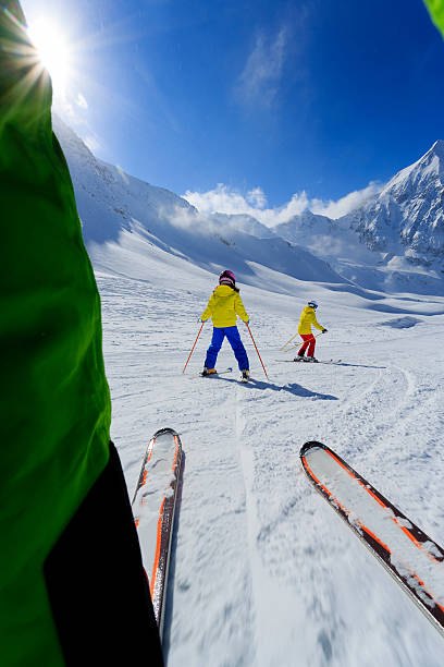 istock Skiing, skiers on ski run 184695296