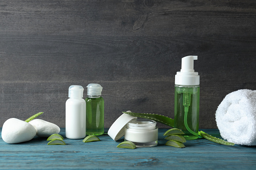 Skin care concept with aloe vera on wooden table