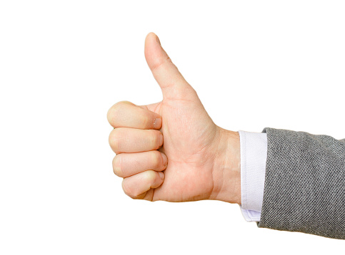 Business man's hand showing thumbs up sign on a white isolated background