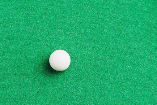 White snooker ball on the snooker green table surface. Sport equipment objectTop view,copy space.