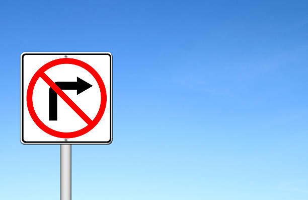 istock Road sign don't turn right over blue sky 184698054