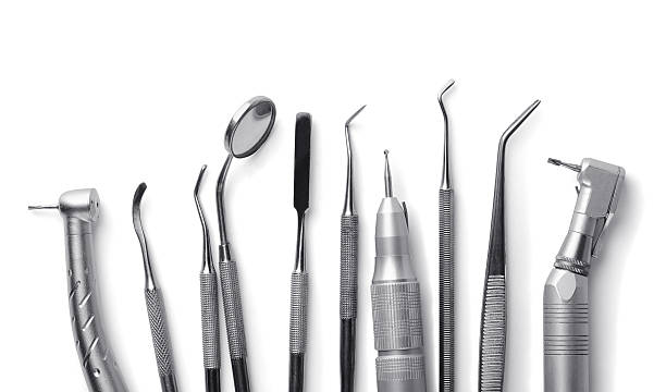 Dental equipment Row of various dental tools isolated on white dental light stock pictures, royalty-free photos & images