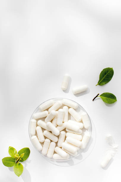istock White capsules with minerals or food additives with an organic composition. Vitamins. Copy space 1846982608