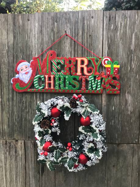 istock christmas wreath on wooden wall 1847005000