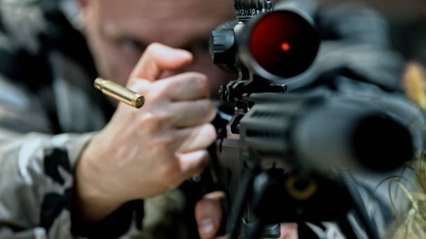 istock Soldier firing machine gun during battle 1847012260