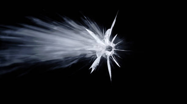 istock Close-up of bullet hole on glass 1847012262