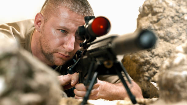 istock Soldier firing machine gun during battle 1847012269