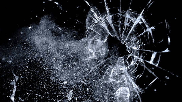 istock Close-up of bullet hole on glass 1847012277