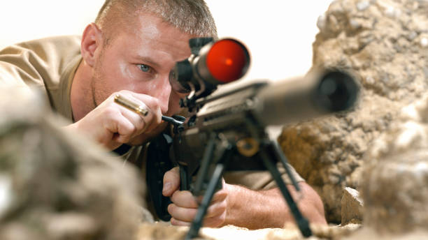 istock Soldier firing machine gun during battle 1847012278