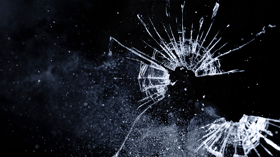 Close-up of bullet hole on glass