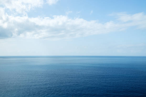 istock Calm sea, horizon sky with light white clouds 1847022305