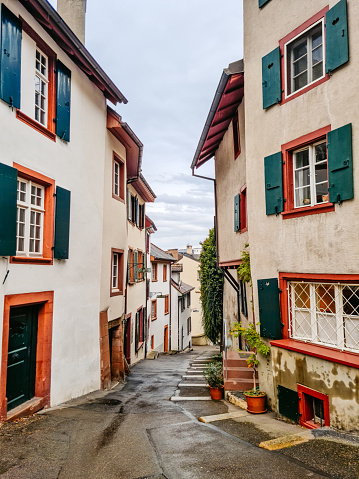 Narrow street and traditional architecture of the old town in Basel, Switzerland.