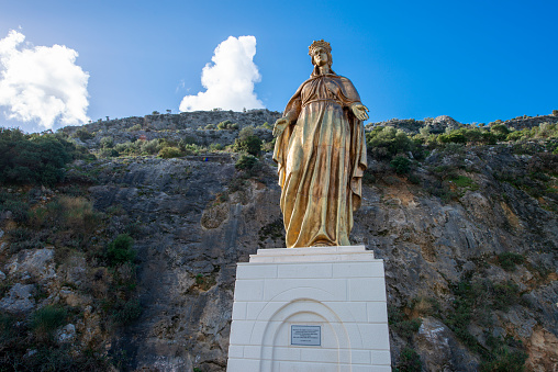 Staglieno, Genoa, Italy - June 22, 2021: Monumental Cemetery.\nMadonna, Cross