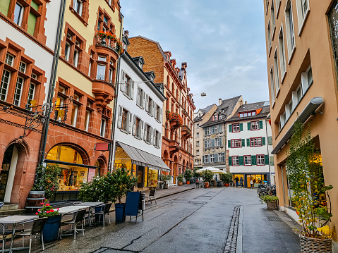 Basel's Old Town with sidewalk cafés, stores and residential buildings in Switzerland.