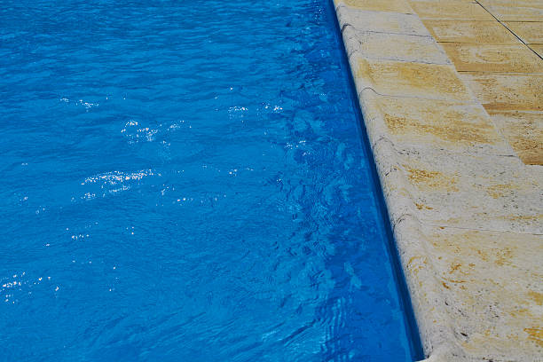 istock Pool filled with clean blue water ready for diving 184703639