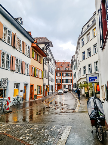 Residential buildings in the old town of Basel on a rainy morning in Switzerland.