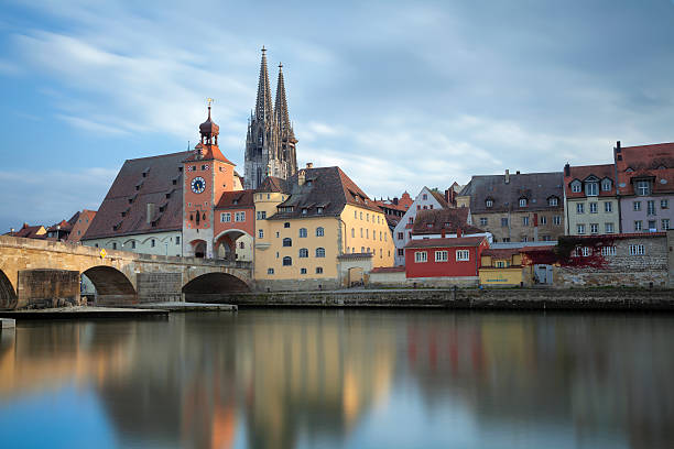 istock Regensburg skyline reflected on water under the bridge 184707566