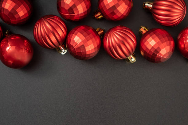Christmas ball on black background Flat lay. New Year background top view with copy space.