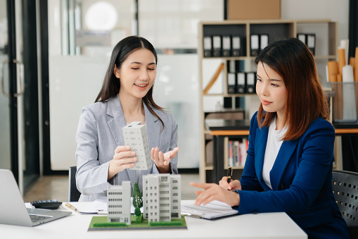 Customers who choose to buy a condominium room and a bank approve a loan for their purchase. Condominium and house loan interest rate from bank concept