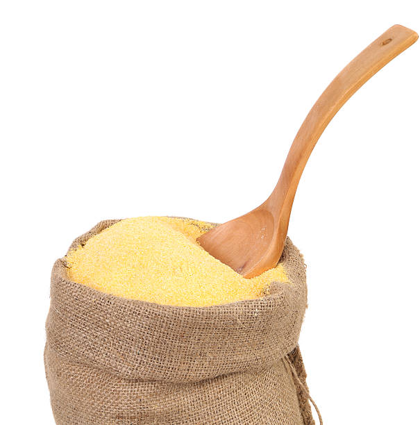 istock bag of ground corn and a wooden spoon 184712694