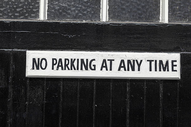 No Parking on a black painted garage door