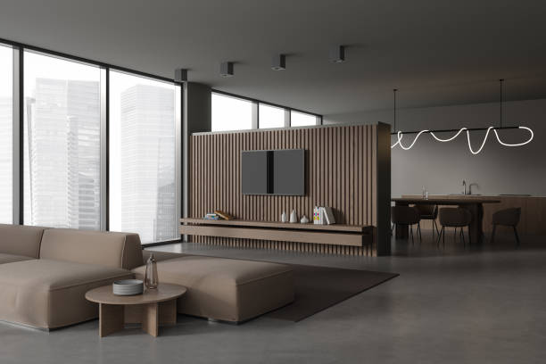 istock Grey studio interior with chill place with tv console and eating space 1847130017