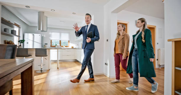 istock Real estate agent showing house to customers 1847139988