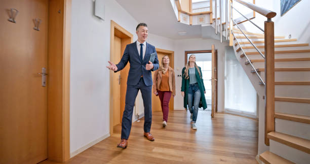 istock Real estate agent showing house to customers 1847139989