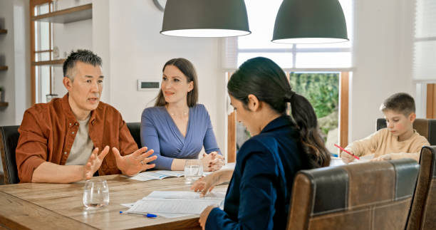 istock Couple talking with financial advisor 1847140034