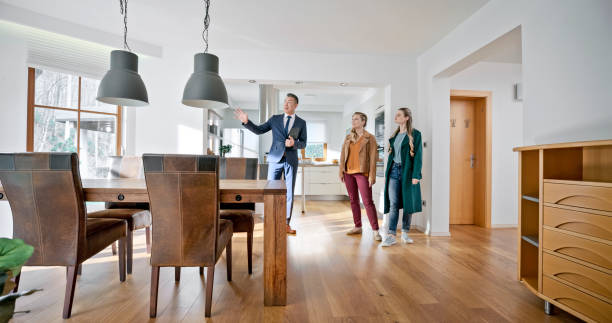 istock Real estate agent showing house to customers 1847140048