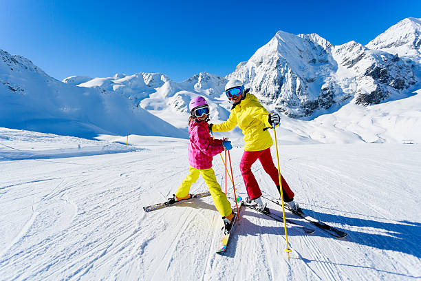 Sskiers on ski run stock photo