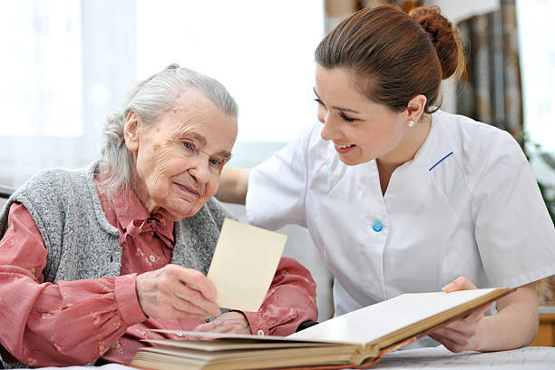 istock Nursing home with nurse and old lady 184714892